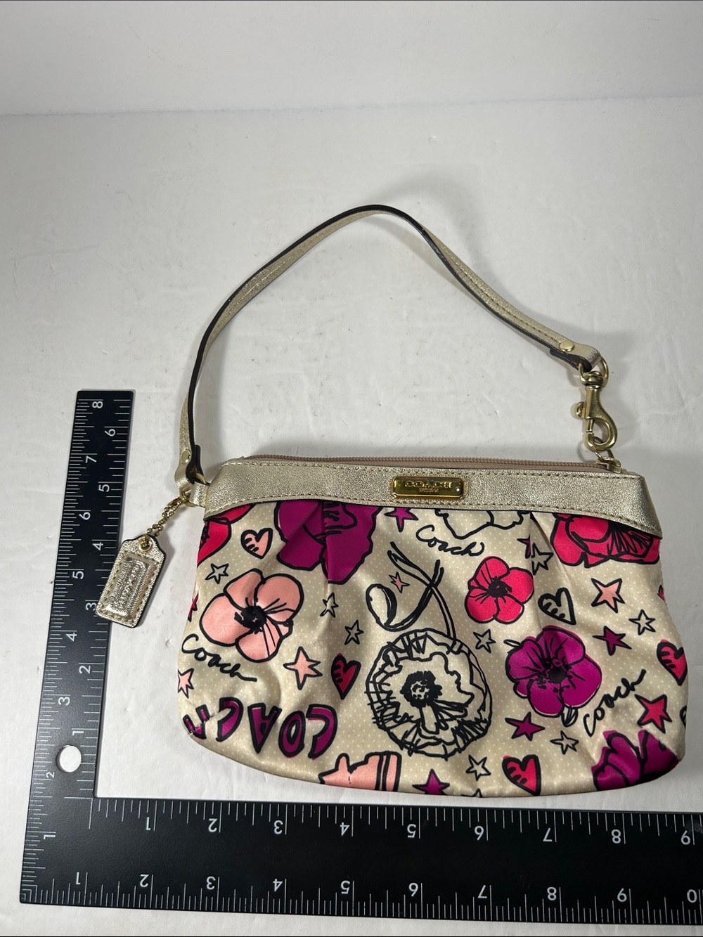 COACH Floral Print Kyra Satin Wristlet Cream Fuchsia Pink Gold metallic trim.